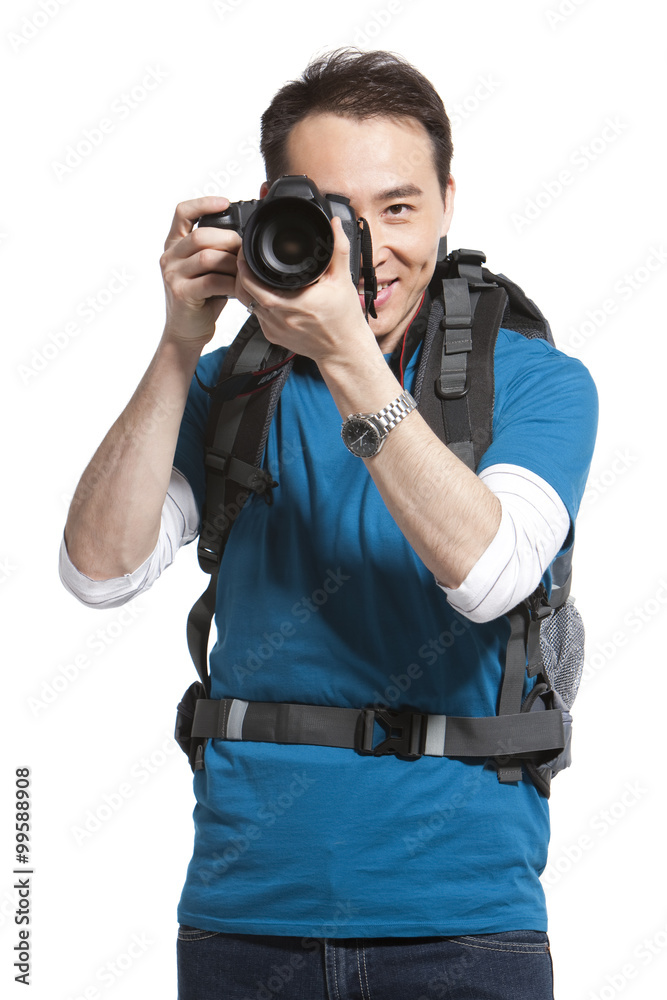 Portrait of a young man holding a camera Portrait of a young man holding a camera