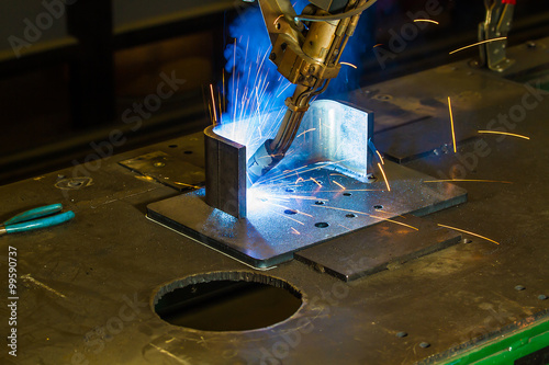 CNC robotic mig welding of half inch steel parts photo