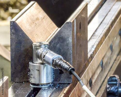 Vibration sensor covered in magnetic steel shavings photo