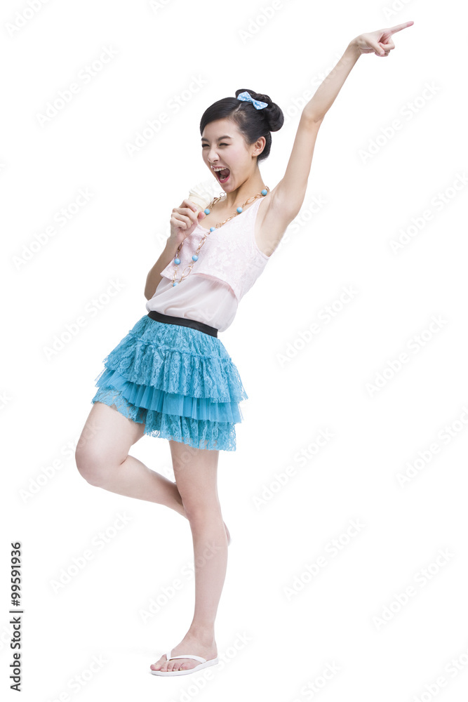 Excited young woman with ice cream cone singing Excited young woman with ice cream cone singing