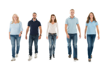 People In Casuals Walking Against White Background