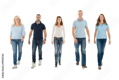 People In Casuals Walking Against White Background