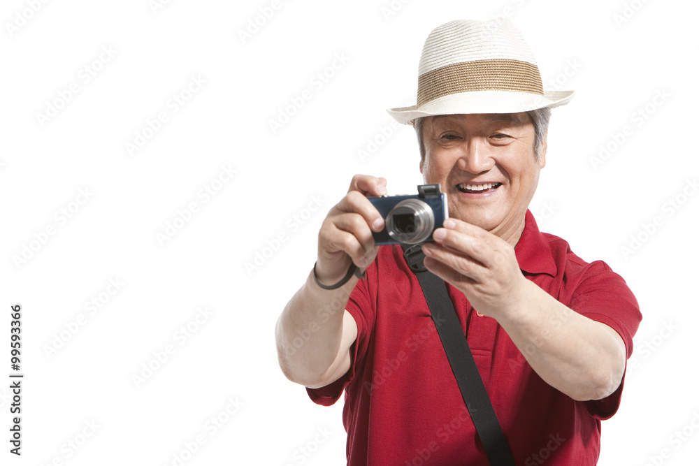 Portrait of senior man holding a camera Portrait of senior man holding a camera