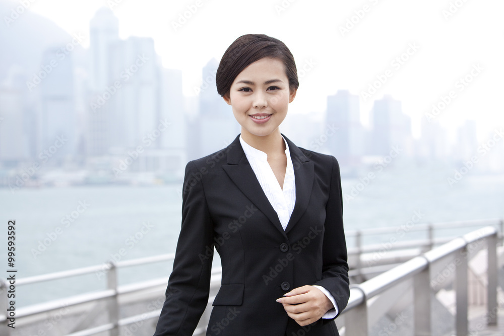 Elegant businesswoman in Victoria Harbor, Hong Kong Elegant businesswoman in Victoria Harbor, Hong Kong