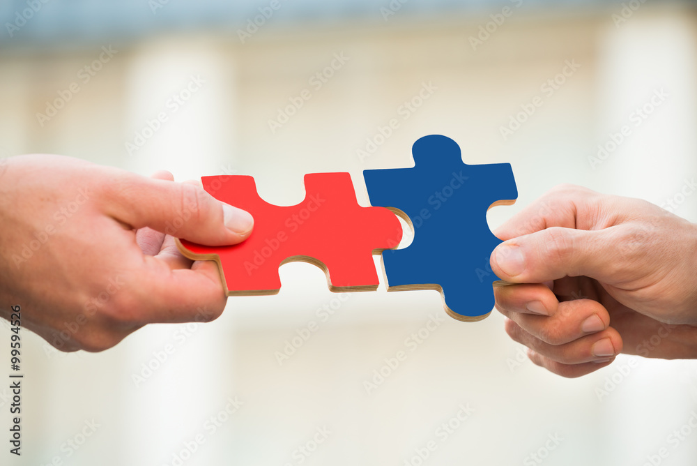 Businessmen Joining Jigsaw Pieces Businessmen Joining Jigsaw Pieces