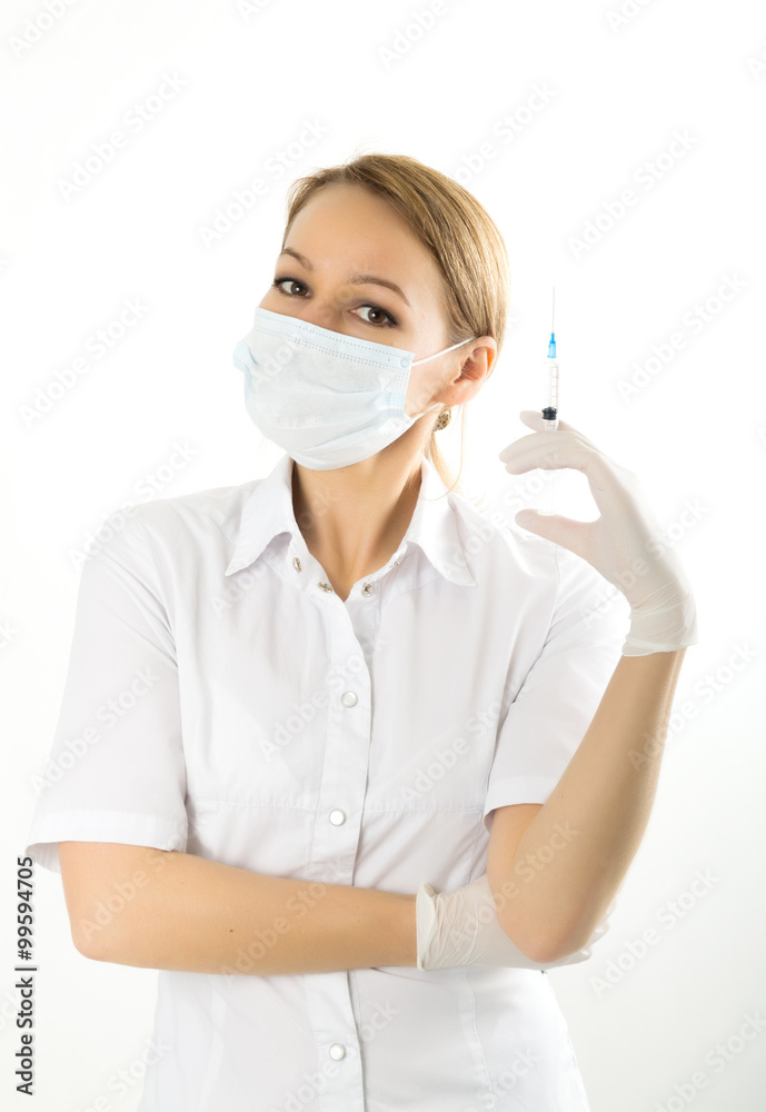 young girl in doctor bathrobe and rubber gloves holding a syringe young girl in doctor bathrobe and rubber gloves holding a syringe