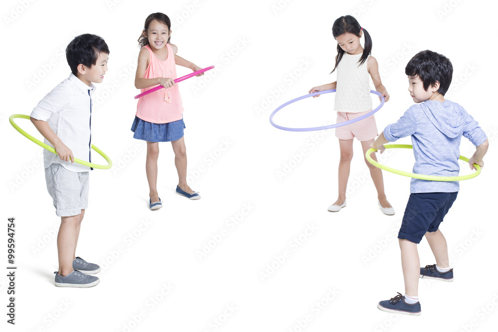 Happy children spinning plastic hoops Happy children spinning plastic hoops