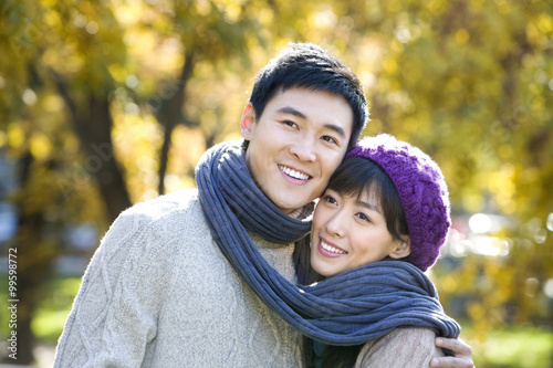 Young Couple Wrapped in a Scarf