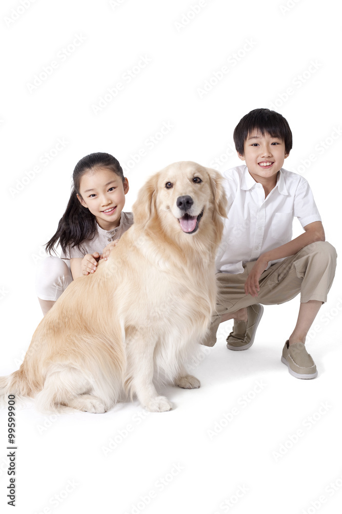 Siblings petting a dog