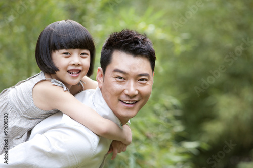 Father and daughter having fun in garden