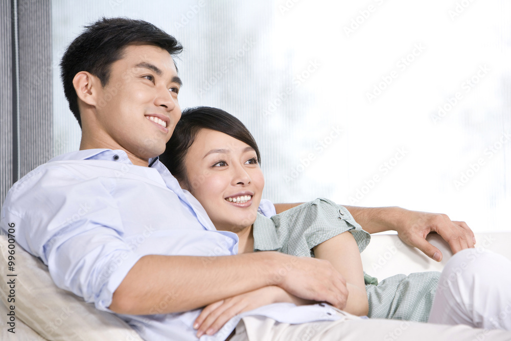 Portrait of a couple relaxing on the couch Portrait of a couple relaxing on the couch
