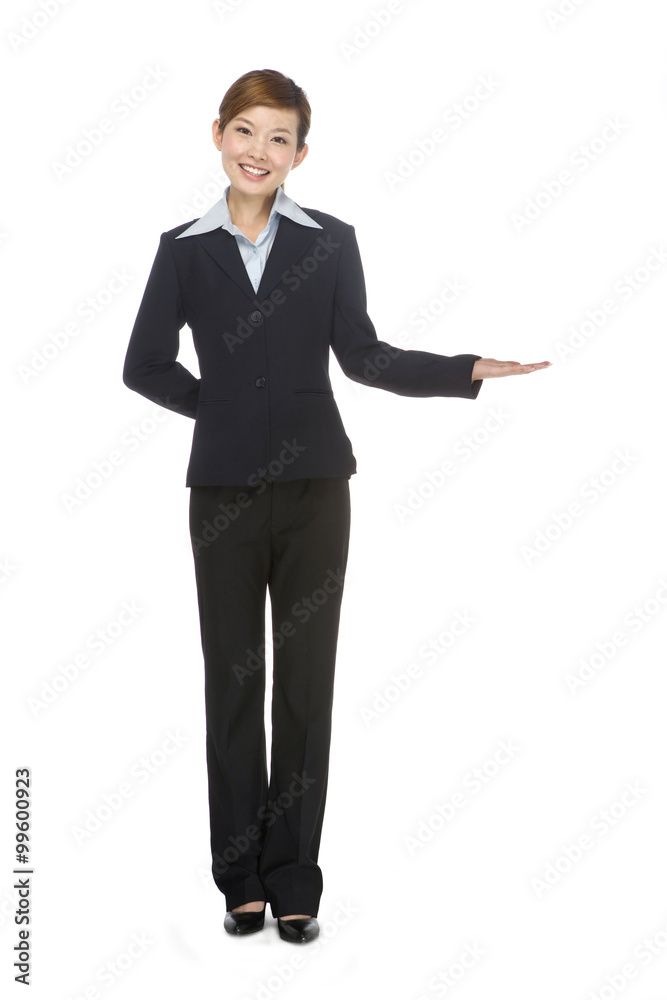 Young businesswoman making a welcoming gesture Young businesswoman making a welcoming gesture
