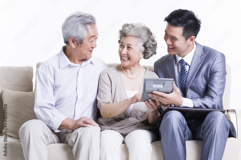 Senior couple with financial advisor Senior couple with financial advisor