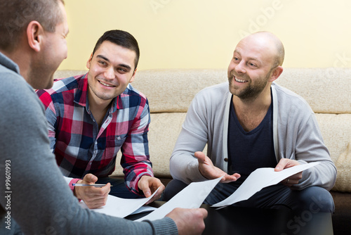 Three positive males with documents photo