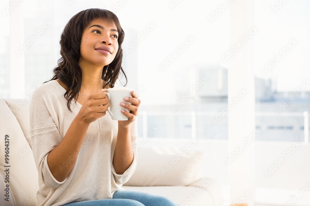 Smiling woman drinking a coffee