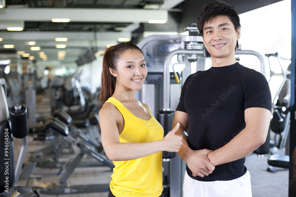 Fototapeta premium Young Couple Together at Gym