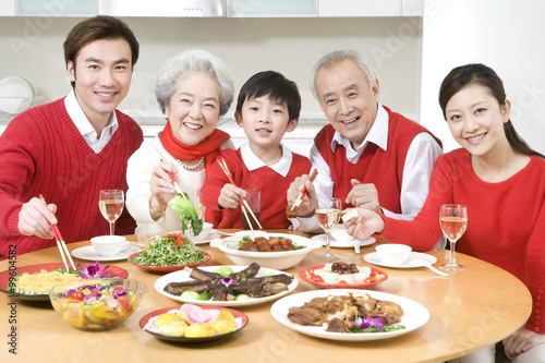 Three generations enjoying a Chinese New Year dinner together