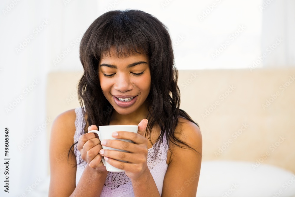 Casual woman holding a cup of coffee Casual woman holding a cup of coffee