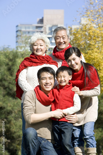 Three Generation Family Enjoying a Park in Autumn