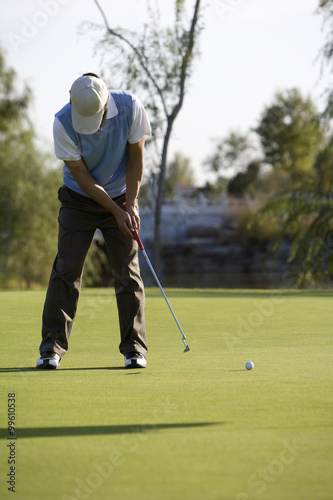 Golfer putting on the Green