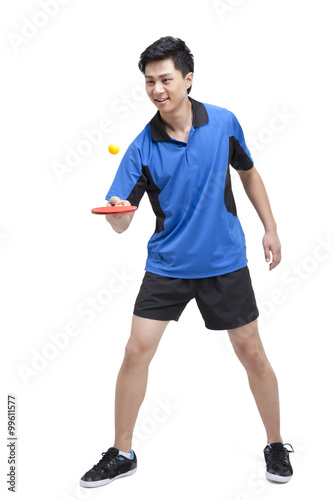Table tennis player bounces ball on paddle © Blue Jean Images