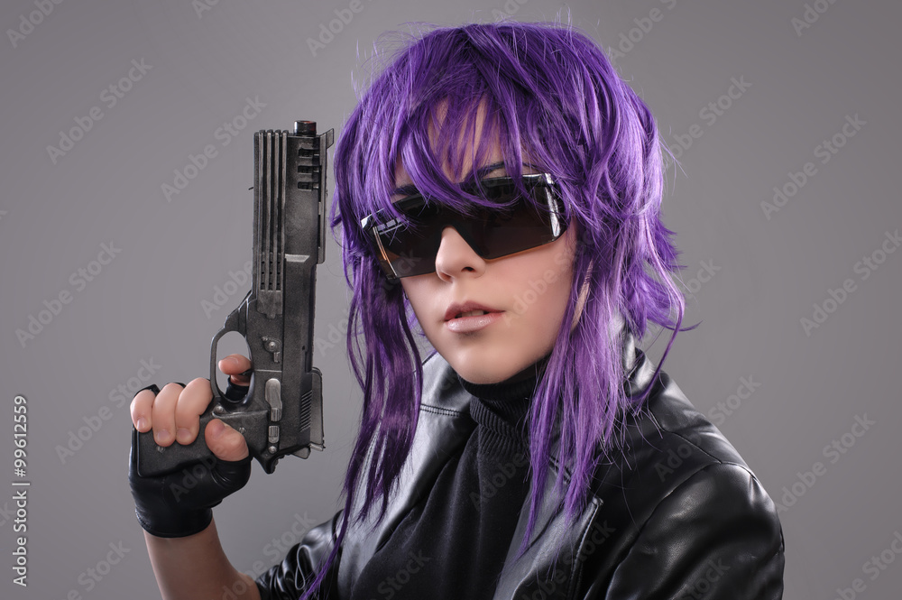Woman with gun / Portrait of sexy woman posing in studio with gun Woman with gun / Portrait of sexy woman posing in studio with gun