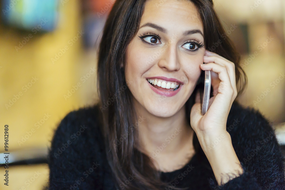 Beautiful brunette using phone Beautiful brunette using phone