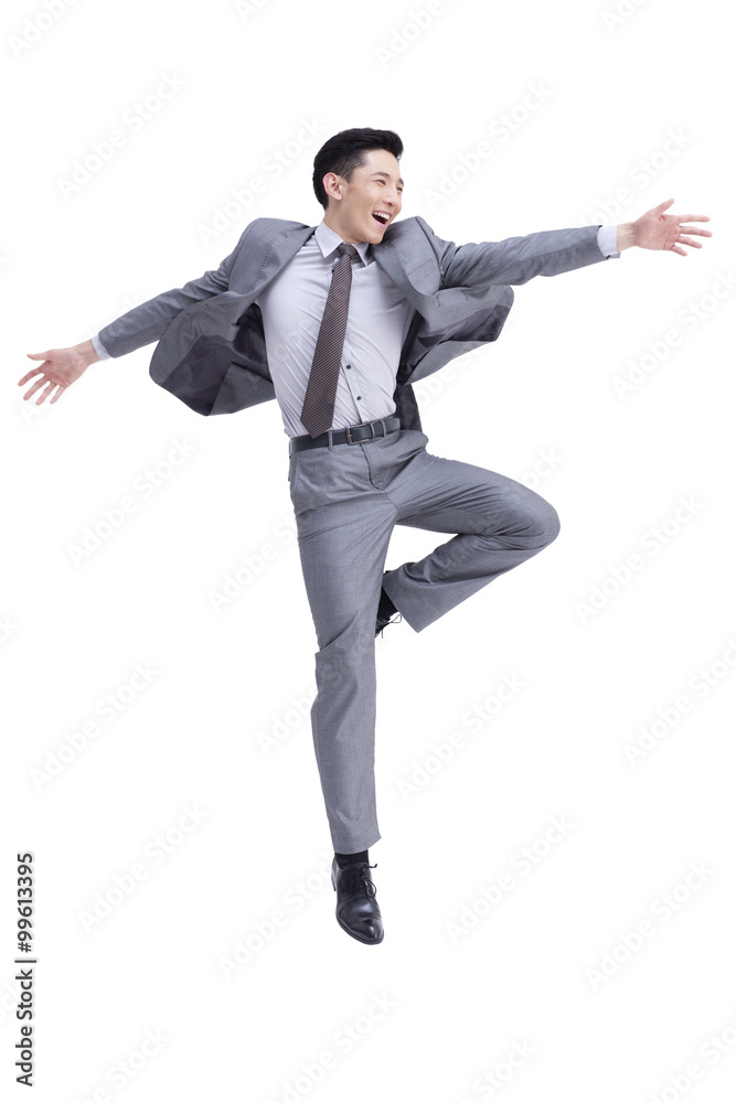 Excited businessman jumping