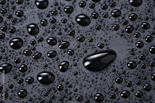 water drops on a black plastic surface