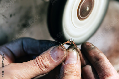 Jeweler polishing jewelry