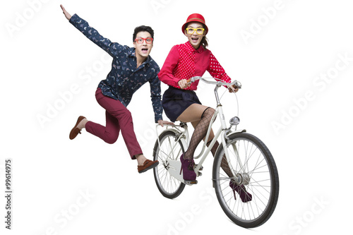 Young couple riding on a bike © Blue Jean Images