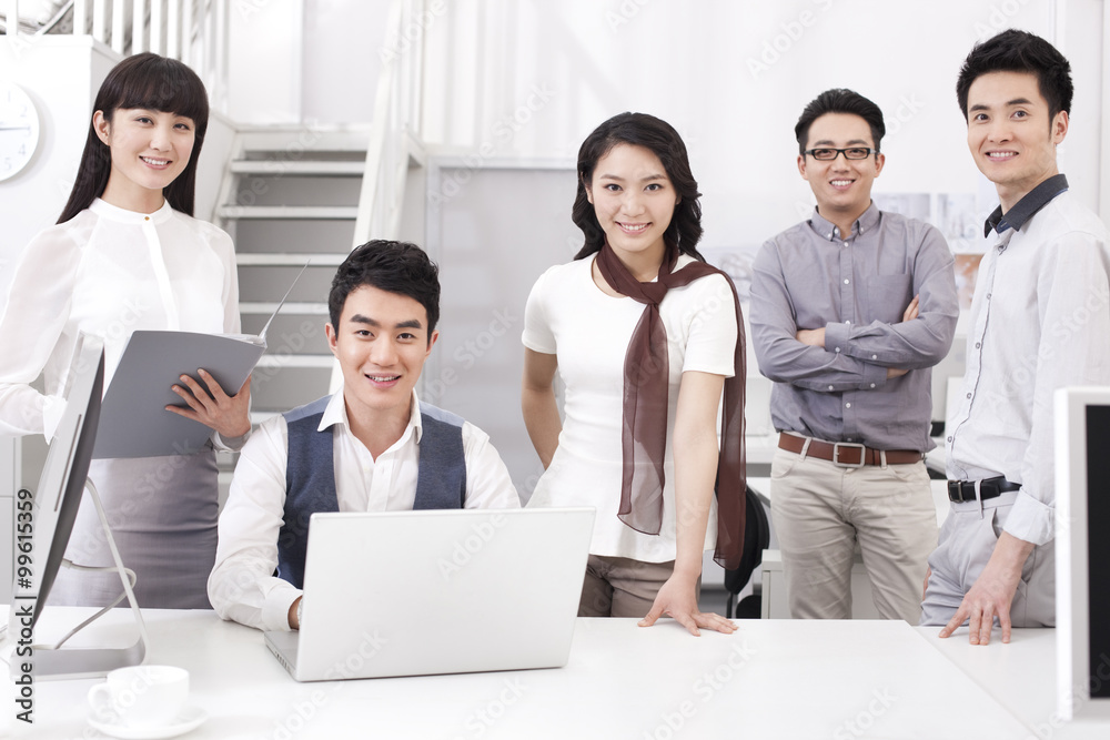 Portrait of happy office workers in studio