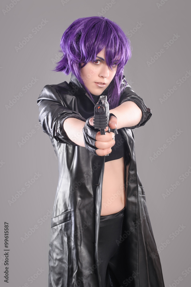 Woman with gun / Portrait of sexy woman posing in studio with gun Woman with gun / Portrait of sexy woman posing in studio with gun