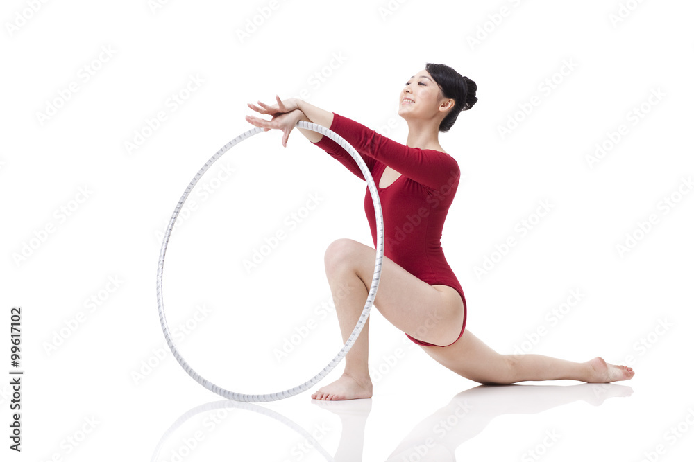 Female rhythmic gymnast performing with hoop Female rhythmic gymnast performing with hoop