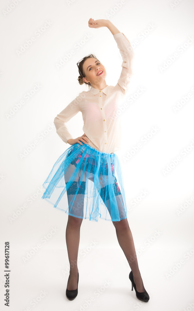 Full length portrait of a beautiful sexy slim model in blue skirt and white blouse transparent, in stockings and garters Full length portrait of a beautiful sexy slim model in blue skirt and white blouse transparent, in stockings and garters