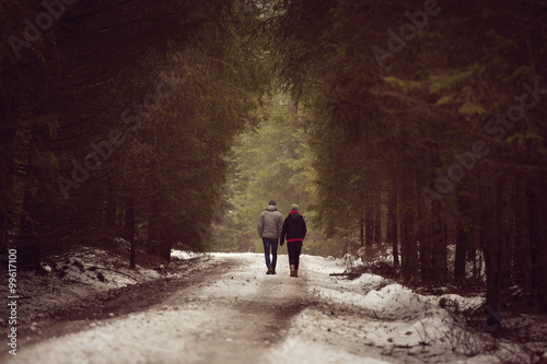 Outdoor happy couple in love posing in cold winter weather. Youn © danmir12