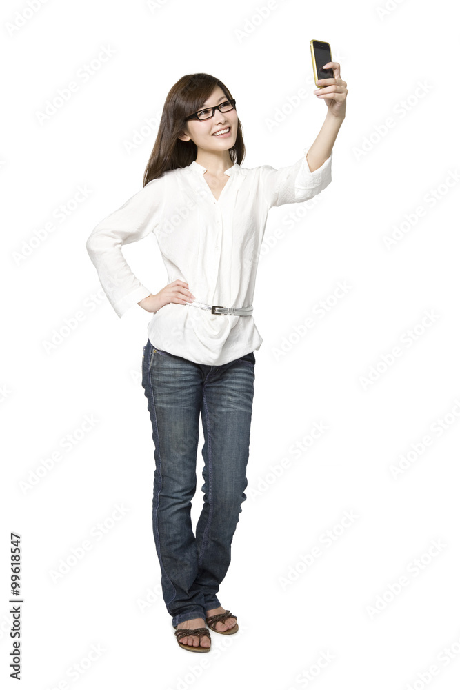 Portrait of Young Woman Taking a Photograph of Herself Portrait of Young Woman Taking a Photograph of Herself