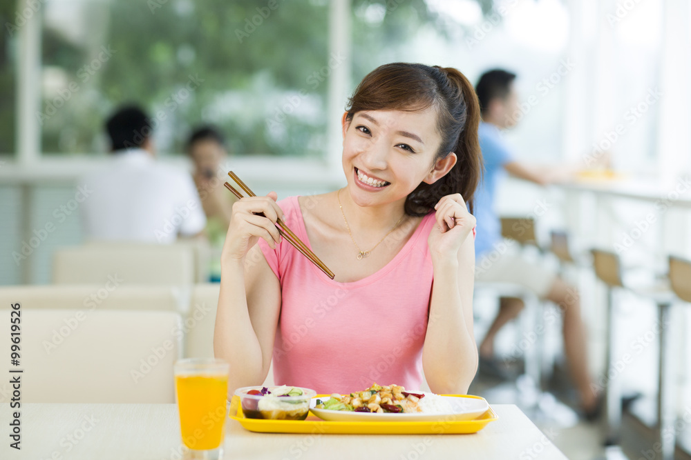 Young woman having a meal in restaurant