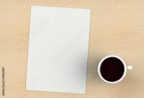 Blank paper and coffee cup on wood table