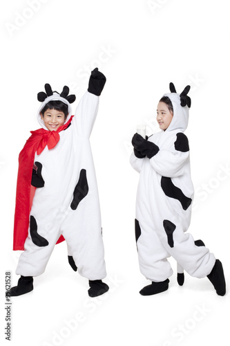 Boy and Girl Dressed in Cow Costumes