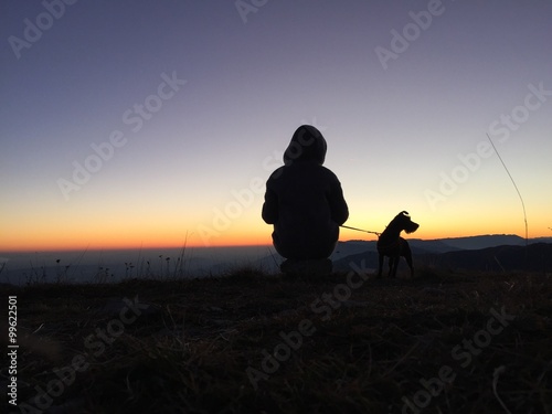 watching the sunset with a dog