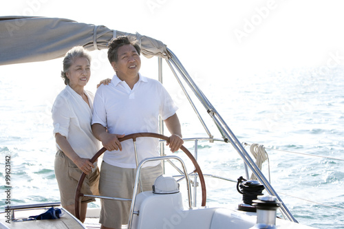 Happy senior couple sailing © Blue Jean Images