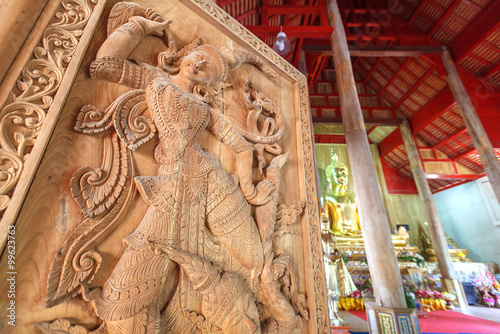 Ancient art pattern on the wooden door in Thai temple