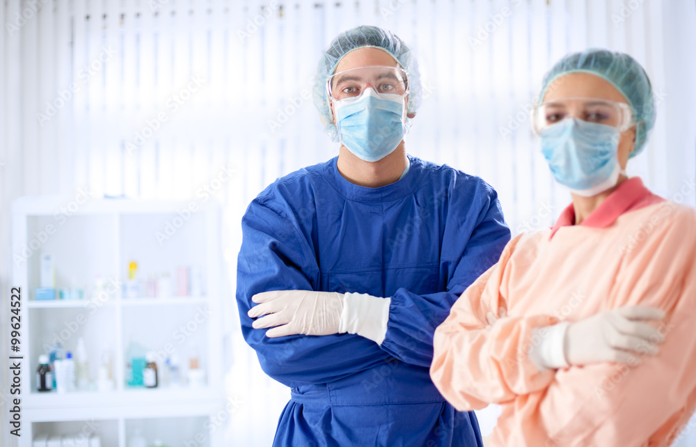 Surgeons standing in a uniform Surgeons standing in a uniform