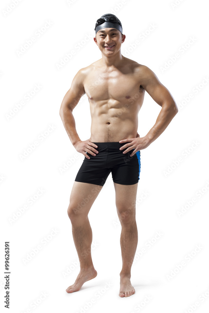 Muscular swimmer with hands on his hips