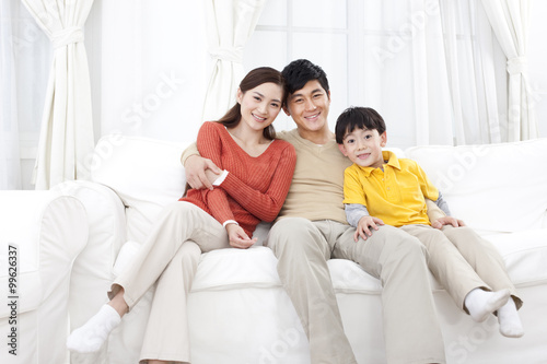Happy family sitting in couch