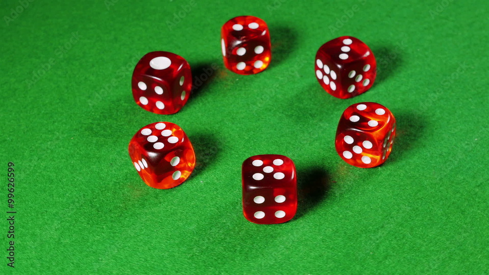 Red dices on the green cloth background. Rotation. Red dices on the green cloth background. Rotation.