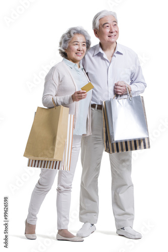 Senior couple shopping with credit card