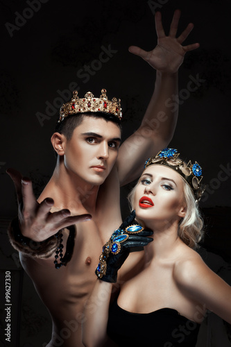 Man and a woman with crown on his head.