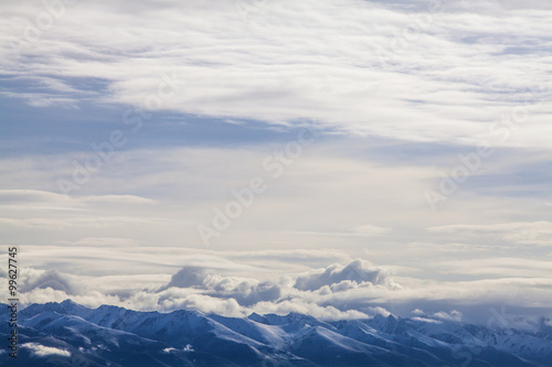 Snow mountains and cloudy sky in Tibet, China © Blue Jean Images